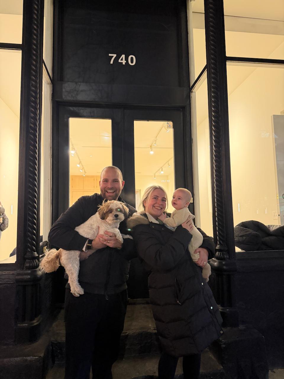 The Jacobs family in front of the Wells & Vision building